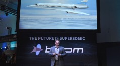 CEO and Co-founder of Boom Technologies Blake Scholl speaks before a large crowd at the XB-1 Supersonic Demonstrator official unveiling at the Boom Technologies hanger on November 15, 2016.