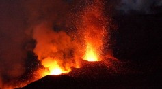 Mount Etna, Europe's most active volcano, explodes spilling lava down the mountain sides and shooting ash into the sky October 30, 2002 near the town of Nicolosi, near Catania, Italy. 