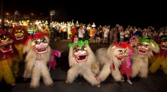 A Dragon and Lion dance is performed before a ceremony releasing water lanterns into the sea to celebrate the mid-summer Ghost Month Festival on August 20, 2013 in Keelung, Taiwan. 
