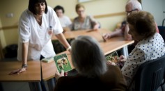 An elderly woman holds a picture of a sheep as she try to remenber the name of the animal during a memory activity at the Cuidem La Memoria elderly home, which specializes in Alzheimer patients on August 2, 2012 in Barcelona, Spain. 
