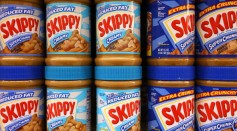 Jars of Skippy peanut butter are displayed on a shelf at Cal Mart grocery store on January 3, 2013 in San Francisco, California.