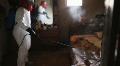 Ebola victim in Liberia being sprayed with disinfectant 