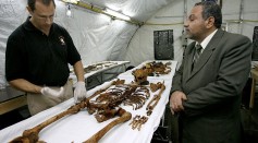 Forensic Experts examining a skelleton