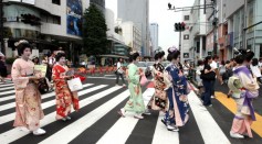 A group of women wearing traditional kimono walk the street in Tokyo Japan on July 16, 2008.