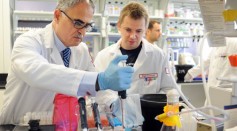  Scientists Dr. Kamel Khalili (L) and Rafal Kaminski, members of the research team work to prepare DNA cells