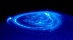 A curtain of glowing gas is wrapped around Jupiter's north pole on Dec. 19, 2000 in a Hubble telescope photo