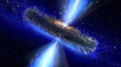 An artist's concept illustrates a quasar, or feeding black hole.