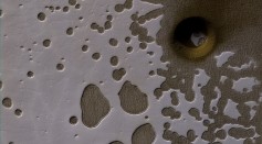 The latest image from NASA's Mars Reconnaissance Orbiter showing deep holes in the South Pole of Mars.