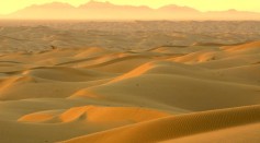 The rising sun illuminates the Algodones Dunes, also known as the Imperial Dunes or American Sahara.