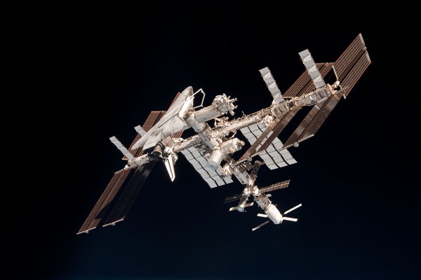 Science Times - Endeavor orbits the Earth docked at the International Space Station