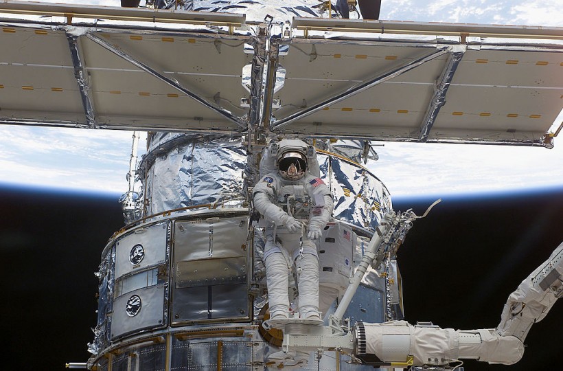 NASA Astronaut Works On Hubble Space Telescope