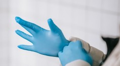 Putting on latex gloves