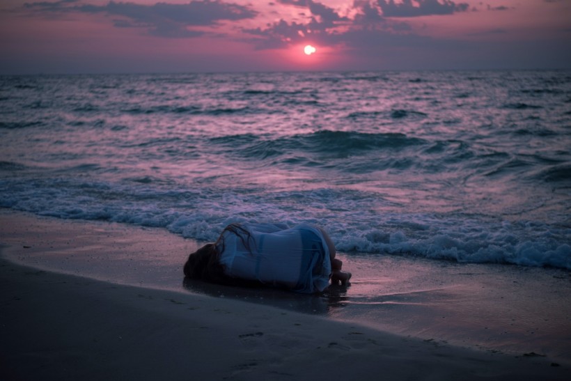 Person lying on beach