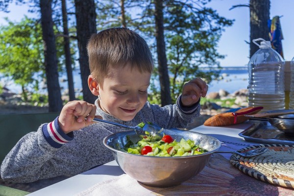 A Child Eating Vegetables