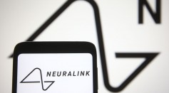 In this photo illustration a Neuralink logo is seen on a...