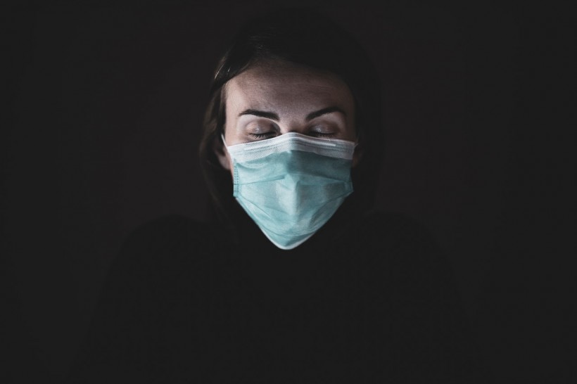 woman-in-black-shirt-and-face-mask-4056206
