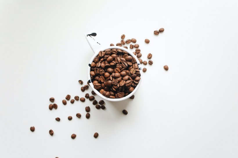 white-ceramic-mug-full-of-coffee-beans-4109750