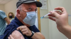 Science Times - COVID-19 Booster Dose: Who Gets the 3rd Jab? Experts Have Yet to Decide If All Brits Need Extra Protection