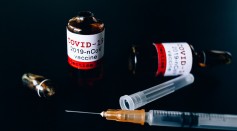 covid-vaccine-bottles-and-syringe-5863437