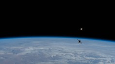 A Russian resupply ship with the full Moon in the background