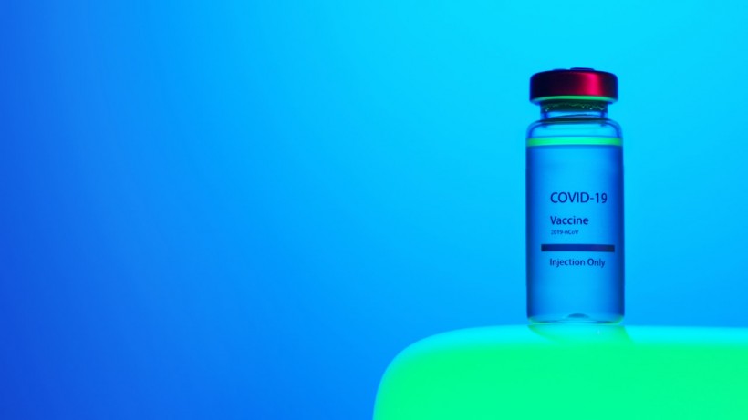 a-close-up-view-of-a-covid-19-vaccine-vial-on-blue-background-5878514