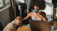 african-american-female-freelancer-using-laptop-and-drinking-coffee-5256142
