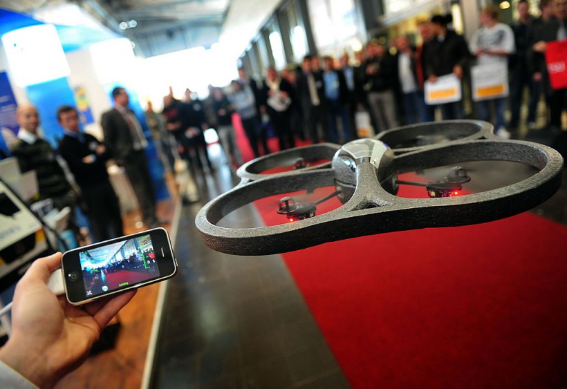 An exhibitor presents the AR Drone