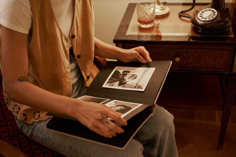 Close-Up View of Woman Watching Photo Album