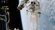 Astronaut William (Bill Mcarthur Appears Suspended Over The Blue And White Earth October