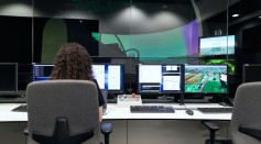 Female aerospace engineer monitors flight simulator