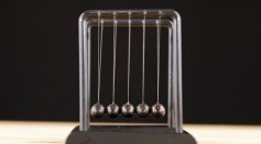 Metal Newton's cradle isolated on white background