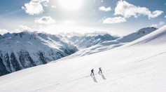 Two Men Hiking on a Snow Mountain