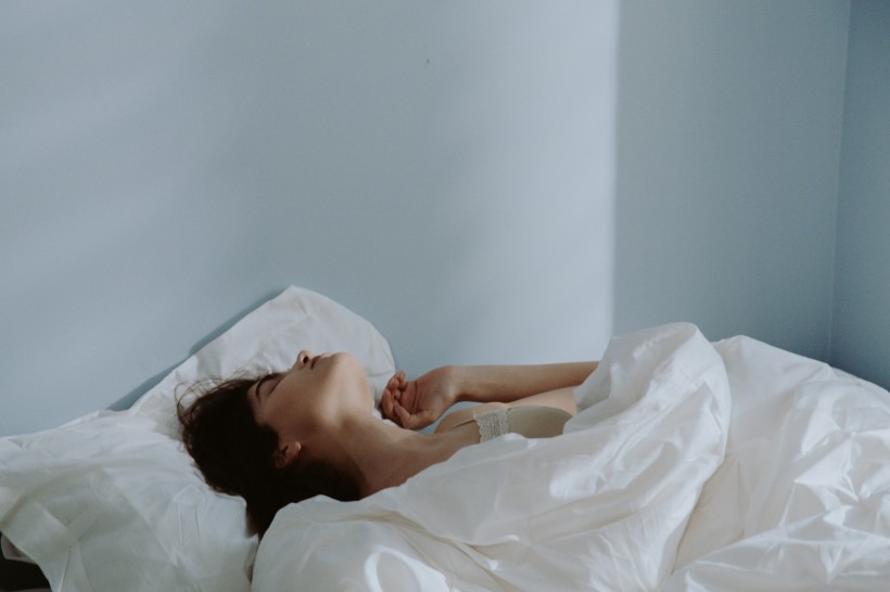 A Woman Sleeping on the Bed