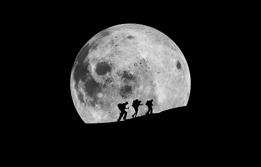 Silhouette Hikers Walking Against Moon At Night - stock photo