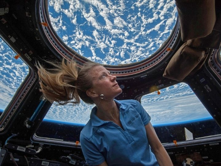 NASA astronaut Karen Nyberg watches Earth from the Cupola Observational Module of the International Space Station.