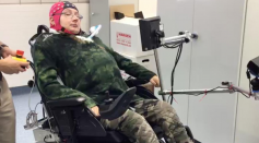 One of the participants, with a complete spasmodic tetraplegia sub C3 and needing assisted ventilation, during his training with the brain-controlled wheelchair.