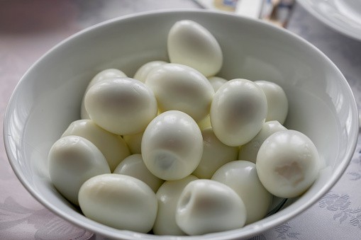 Bowl of boiled eggs on table during Easter in Poland