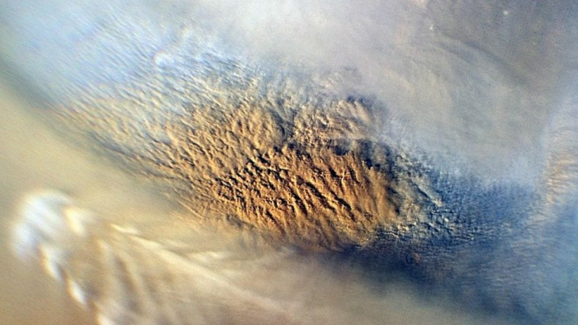 A dust storm rampages over Mars. 
