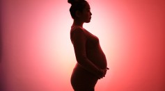Portrait of a pregnant woman who is about to give birth. - stock photo