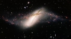 Rare Polar Ring Galaxy Resembles Giant Eye in Space, Similar Clusters Might Be More Common in the Universe Than Previously Thought