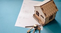 Wooden House Moder, Keys and Contract on Table