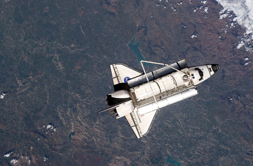 Space Shuttle Discovery Continues On Its Last Mission