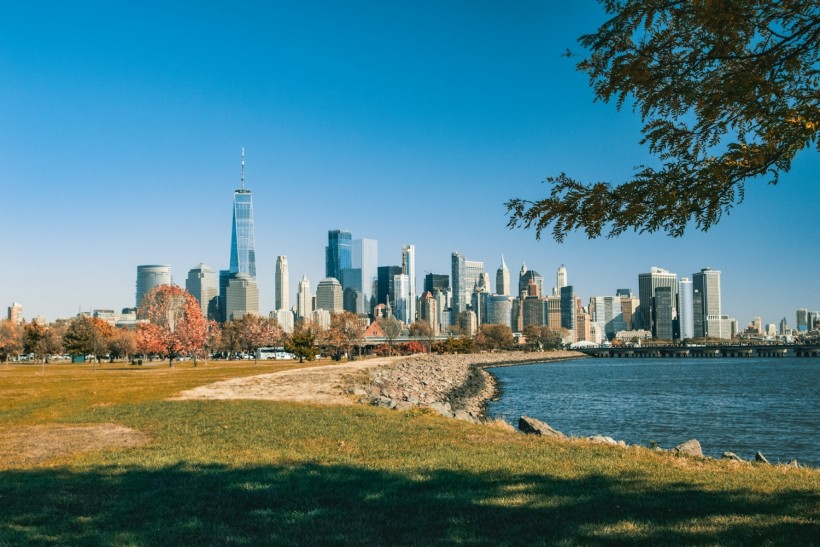 Park in Jersey City with a view of the city skyline on a sunny day