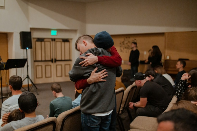Two people hugging during a support group session at one of the rehab centers in New Jersey