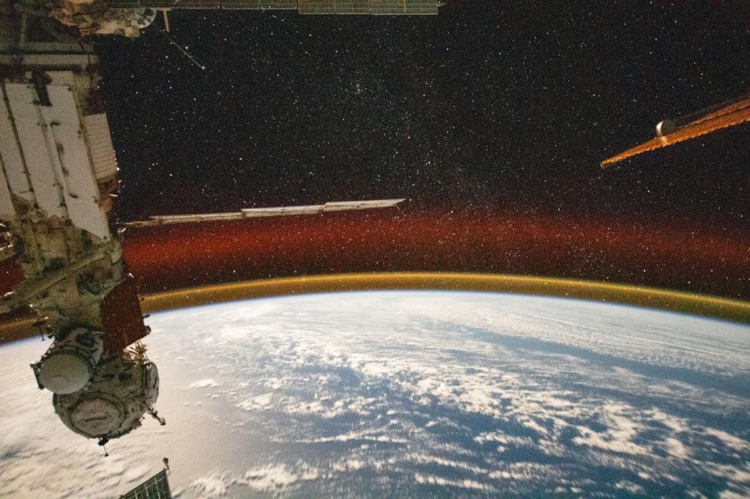 International Space Station Captures Mesmerizing Golden Airglow Above Earth's Horizon