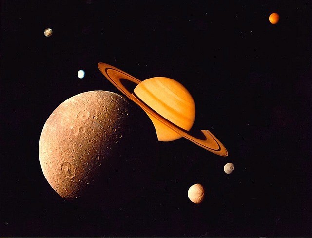 NASA's Cassini Space Probe Captivates the Enchanting Realm of Saturn's Moons