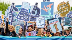 group of people with signages