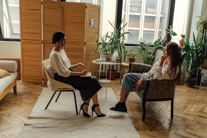 A mental health professional having a therapy session with her patient