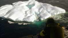 From an altitude of 500 feet a photographer captures an image of an iceberg from the cargo ramp of a Coast Guard Hercules C-130 Aircraft April 21, 2003 in the north Atlantic Ocean.