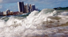 Buildings are seen near the ocean as reports indicate that Miami-Dade County in the future could be one of the most susceptible places when it comes to rising water levels due to global warming.